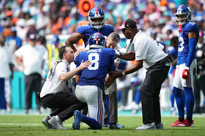 Daniel Jones (8) was sacked six times and suffered a neck injury in the New York Giants' 31-16 loss to the Miami Dolphins.
